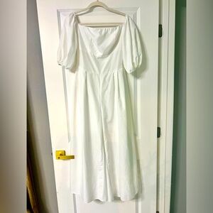 Adorable off the shoulder, puff sleeve, 1 piece jumpsuit with zippered back.